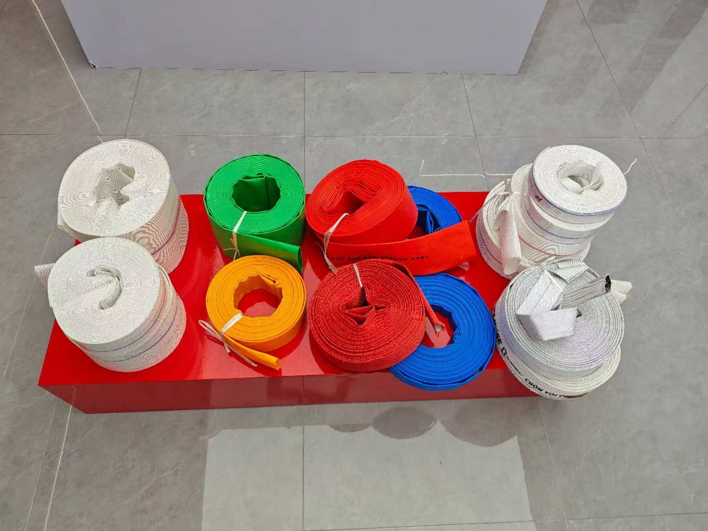 Coloured fire hose coiled on the showroom display